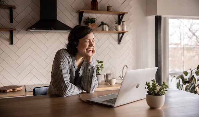 Contractor laughing on video call with client